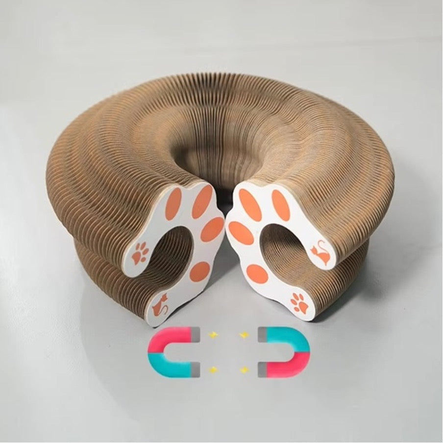 Expandable cat scratching pad toy shaped into a round form with magnetic connection