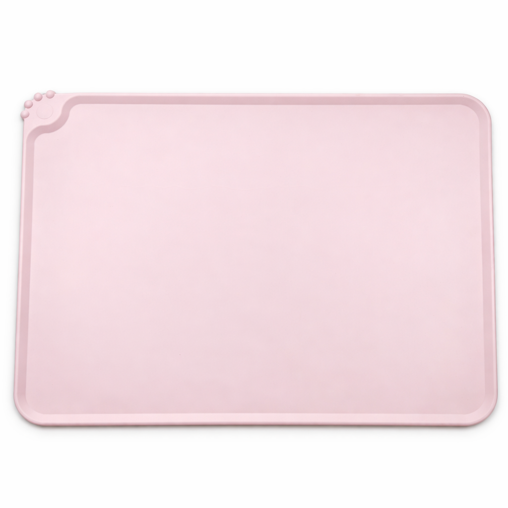 Pink silicone pet feeding mat with raised edges and paw corner